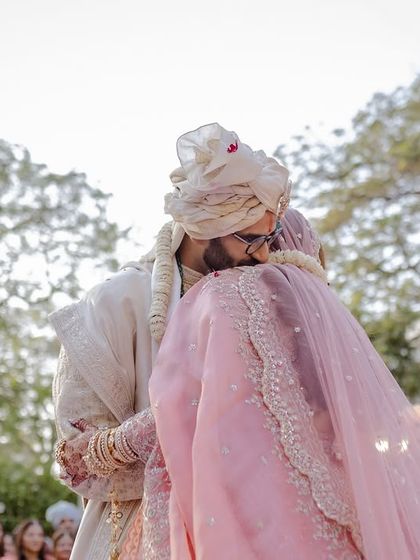 The first hug as husband and wife after the Varmala.