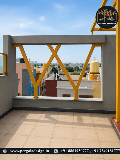 A design detail of the yellow pergola structure, showing a unique 'Y' shape support that adds an architectural flair to the railing.