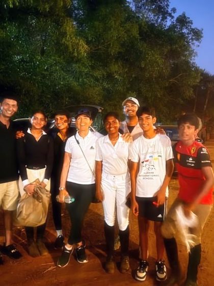 My team enjoying a moment of rest and friendship at the Auroville Horse Show. The bonds formed here go far beyond the competition arena.