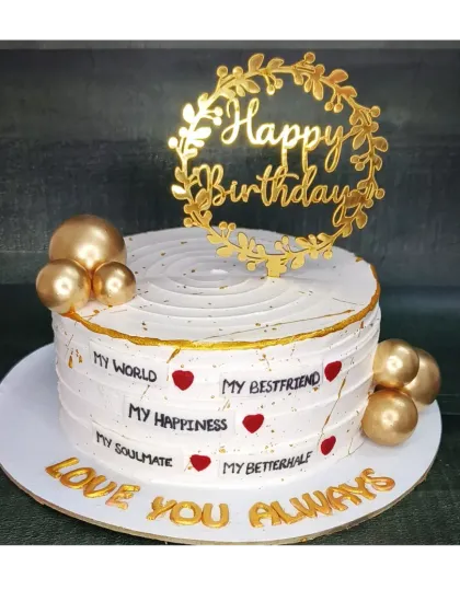 A heartfelt birthday cake for a loved one, with messages like "My World" and "My Soulmate". This is a chocolate mousse coffee cake with elegant gold ball decorations.