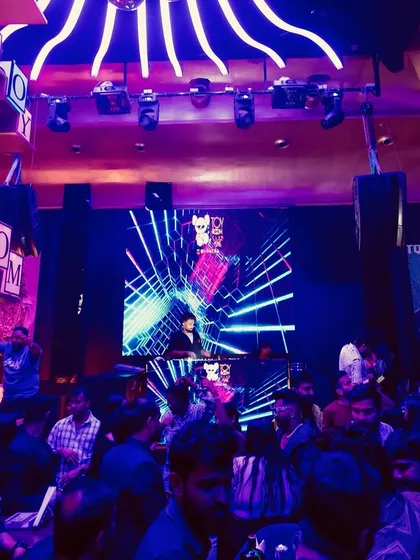 A wide shot of the party at Toy Room. My job is to revive the dance floor and keep the energy high all night.