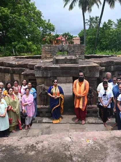 A group of participants at the ancient 64 Yogini Temple in Odisha, a site of immense feminine spiritual power.
