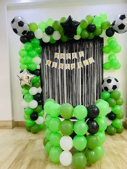 The complete football goal balloon decoration, ready for a young sports fan's birthday party.