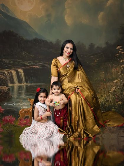 A timeless portrait of a mother and her children in traditional Indian attire. The mother's elegant saree and the children's classic outfits create a beautiful, culturally rich family photo.