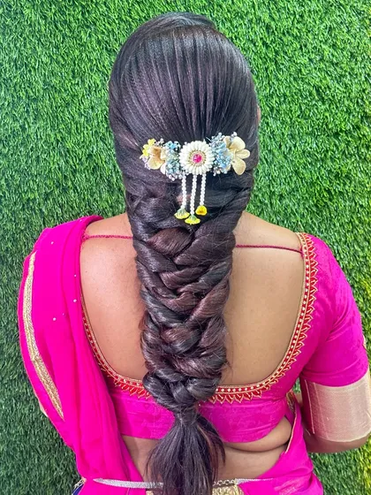 A complete makeover includes beautiful hair. In my course, we cover over 15 professional hairstyles, like this intricate South Indian braid, ensuring my students can deliver a full package to their clients.