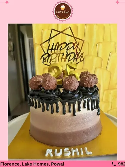 An elegant birthday cake for a chocolate lover, topped with Ferrero Rocher chocolates and a rich black cocoa drip. The dual-tone frosting adds a modern touch to this decadent creation.