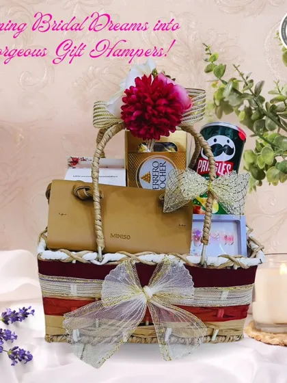 Turning bridal dreams into gorgeous gift hampers. This basket for the bride-to-be includes a mix of treats like Ferrero Rocher and Pringles, along with a stylish Miniso pouch, all beautifully arranged.