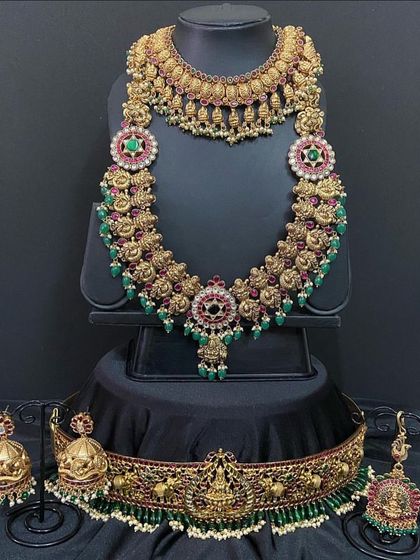 Another view of the floral haaram set, showing the beautiful jhumkas and maang tikka that complete the look. All pieces are available for rent.
