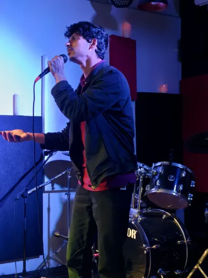A stand-up comedian delivering his set during our Candlelit Experience. The intimate setting makes for a great comedy room where the connection with the audience is immediate.