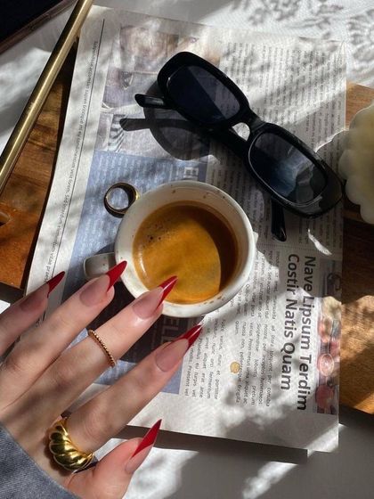 My morning coffee just hits different when my nails are on point. Loving these long, red stiletto nails.