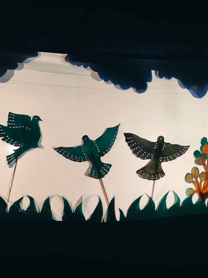 The beauty of Chitrakathi lies in its simplicity and detail. Here, a flock of birds takes flight across the screen, each puppet manipulated by hand to create a dynamic and enchanting visual story for the audience.