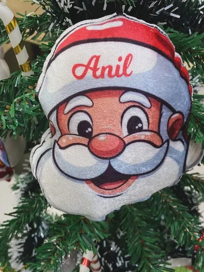 A close-up of the personalised Santa Claus plush ornament.