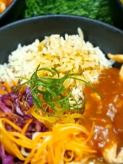 A hearty and delicious Chicken Donburi bowl. This Japanese-inspired dish with rice, chicken, and fresh vegetables is a great option for a more substantial meal at a party.
