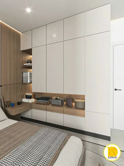 A close-up of the custom wardrobe, highlighting the combination of closed cabinets and open display niches.