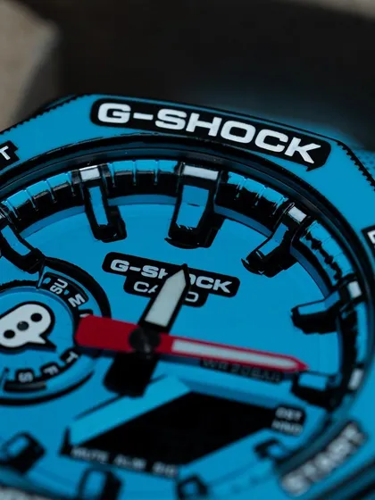 A close-up of the dial, where the 2D effect is most prominent. The hands and markers are designed to look hand-drawn, making this a true piece of wearable art.