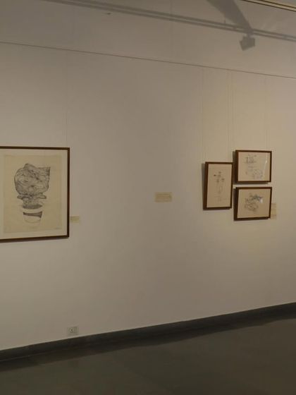 An installation view of 'Bring me Flowers', showing the clean, minimalist arrangement of framed drawings on the gallery wall.