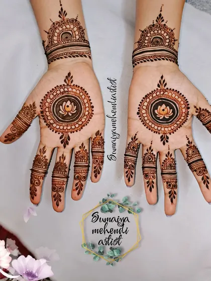 A beautiful engagement henna design with a lotus mandala.