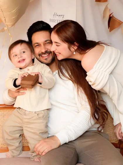 A candid moment of pure joy as a family plays together during their son's first birthday photoshoot. This photo captures the authentic, unposed happiness that I love to photograph.