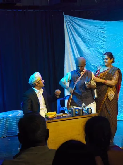 Students of our acting workshop performing a scene from a classic Kannada play, showcasing their character work.