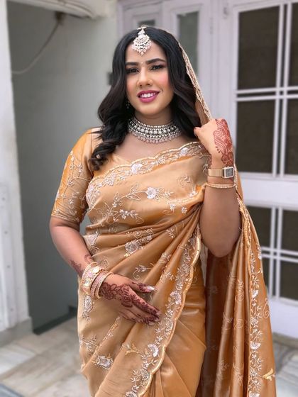 The full look, showcasing the beautiful organza saree and the minimal makeup. This is perfect for the modern bride who believes that less is more.