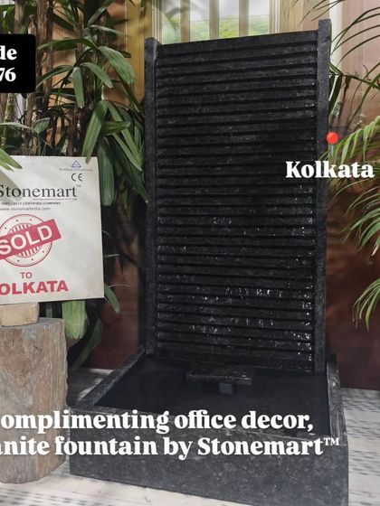 The 3-foot granite fountain is shown complimenting an office decor setting, adding a touch of nature and calm to the workspace.