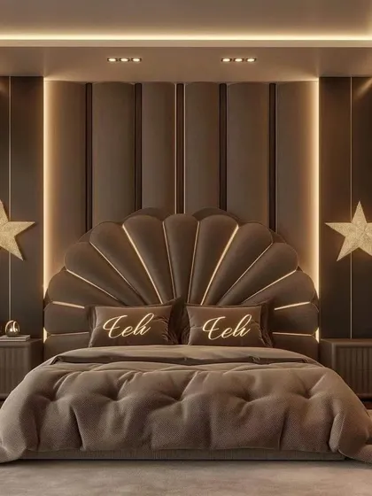 A symmetrical and luxurious bedroom design centered around a statement shell headboard, flanked by modern nightstands and star-shaped lights.