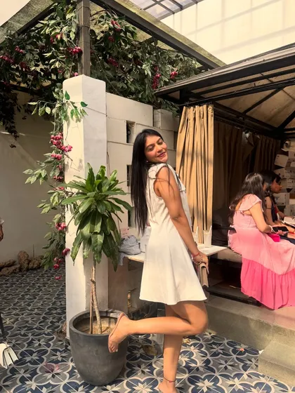 A playful shot in the white dress. My styling is all about finding clothes that you can have fun in and feel good wearing.