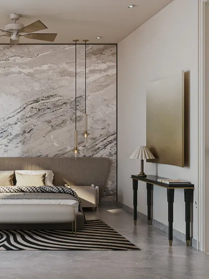 A view of the marble accent wall, which sets a tone of opulence. The minimal yet bold furniture allows the natural beauty of the stone to take center stage, creating a refined and elevated atmosphere.