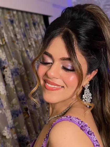 A close-up showing the beautiful purple shimmer eyeshadow and the 'glass skin' finish that makes her glow.