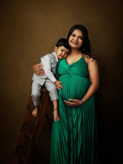 A beautiful maternity portrait with a mother-to-be and her son. His gentle hug around her belly is a sweet preview of the sibling bond to come.