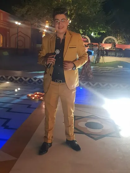 Posing for a photo after a successful show at a Diwali party. The festive lights and happy atmosphere provide a perfect backdrop for an evening of magic and mystery.