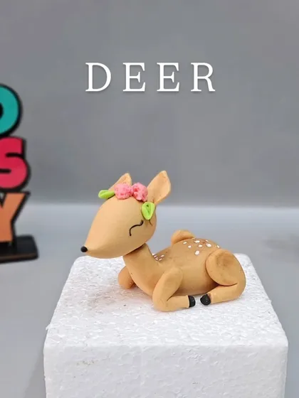 The adorable fondant deer from the jungle cake class. Learning to create different animals in various poses is a valuable skill.