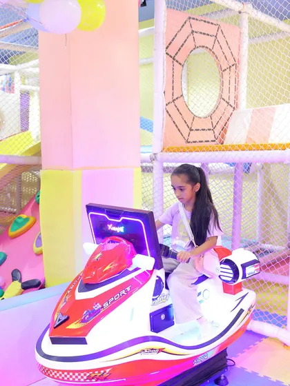 This young guest is enjoying one of our arcade rides during a construction-themed birthday party.