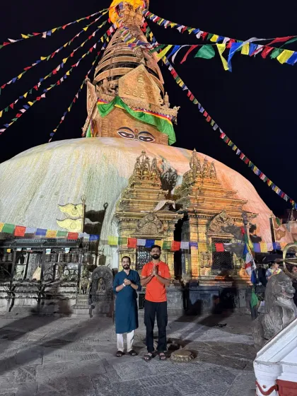 In the quiet of the night, we stand in reverence before the great Bouddhanath Stupa in Nepal. The air is thick with prayer, and the eyes of the Buddha watch over us as we offer our gratitude.