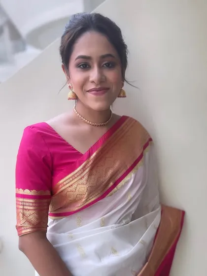 A portrait of the South Indian bride, her hair styled in a timeless and elegant updo.