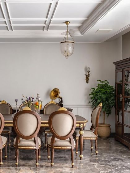 I believe in creating spaces that become the backdrop for your happiest moments. This timeless dining room, with its classical furniture and vintage gramophone, is designed for gathering with family and friends to celebrate life.