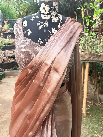 The 'SAJEELI' saree paired with its fully sequined blouse. This combination is perfect for cocktail parties and receptions.