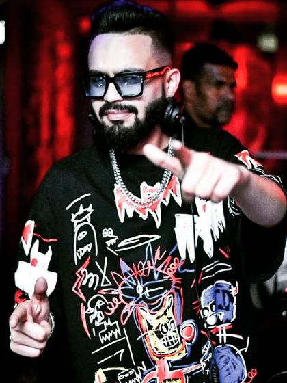 If opportunity doesn’t knock, build a door. A stylish shot of me at Boomrang, pointing at the crowd and bringing the energy.