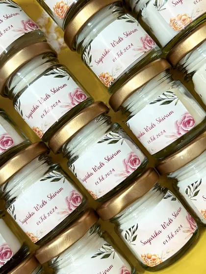 The wedding favors for Sagarika and Shivam, all lined up. We can create different label designs, like this one with a beautiful rose illustration.