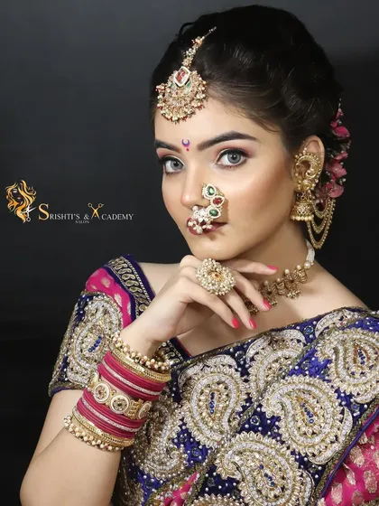 Another angle of the stunning Maharashtrian bridal look, highlighting the classic hairstyle and intricate gold jewelry that completes the look.