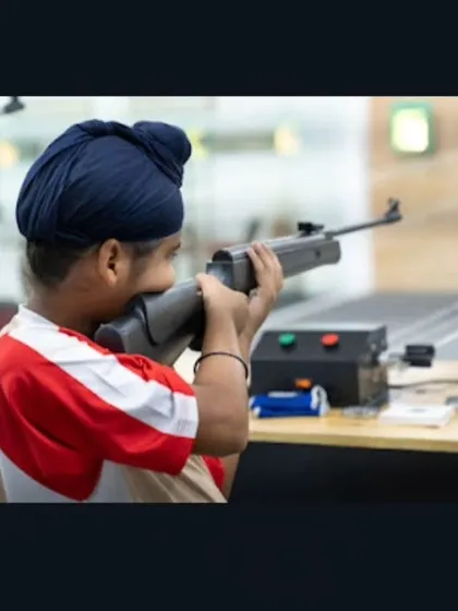 Even our youngest members learn the fundamentals of safe and effective shooting. Here, a young boy takes aim with an air rifle under careful supervision.