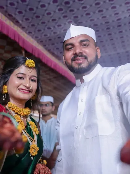 The happy couple reaches out to the camera during their Haldi, inviting everyone to share in their joy.