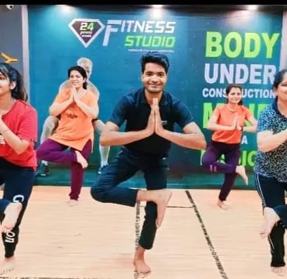 A happy group session at a fitness studio in Malviya Nagar, Delhi. I lead group classes that are energetic, fun, and suitable for all levels. Here we are practicing Vrikshasana, the tree pose, to improve balance and concentration.