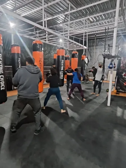A busy evening at our Noida Extension club. The large, open space allows for multiple activities at once, from bag work to ground drills.