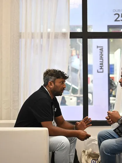 An in-depth conversation happening in the lounge area of our booth. We create comfortable spaces for visitors to sit down and discuss their projects in detail with our experts.