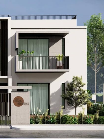The facade of the Sandeep Mukim Residence is characterized by its simple geometry and refined detailing. The recessed balcony and contrasting material finishes add depth and interest to the elevation, creating a home that feels both contemporary and timeless.
