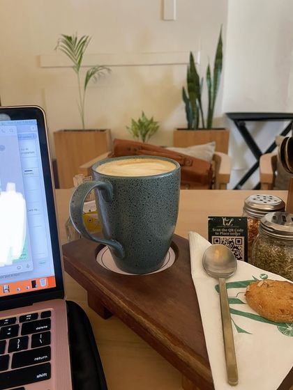 Another work session from a cafe. As an online coach, I have the flexibility to work from anywhere, blending my passion with my lifestyle.
