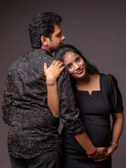 A tender and quiet moment of embrace. This pose is perfect for showing the supportive and loving bond between partners.