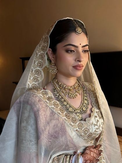 Another angle of Sanya's serene bridal look. The makeup is perfectly balanced to complement her heavy jewelry without competing with it.