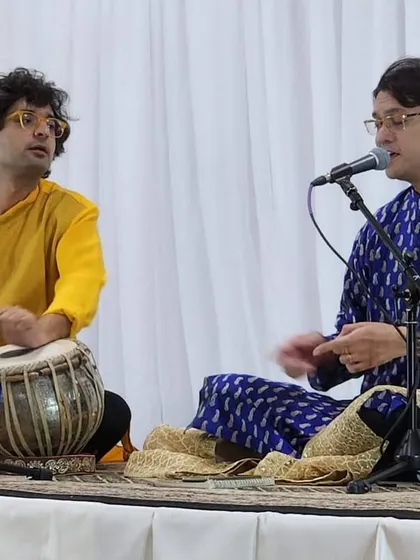 A moment of interaction on stage with Sounak da. These small exchanges guide the direction of the music.